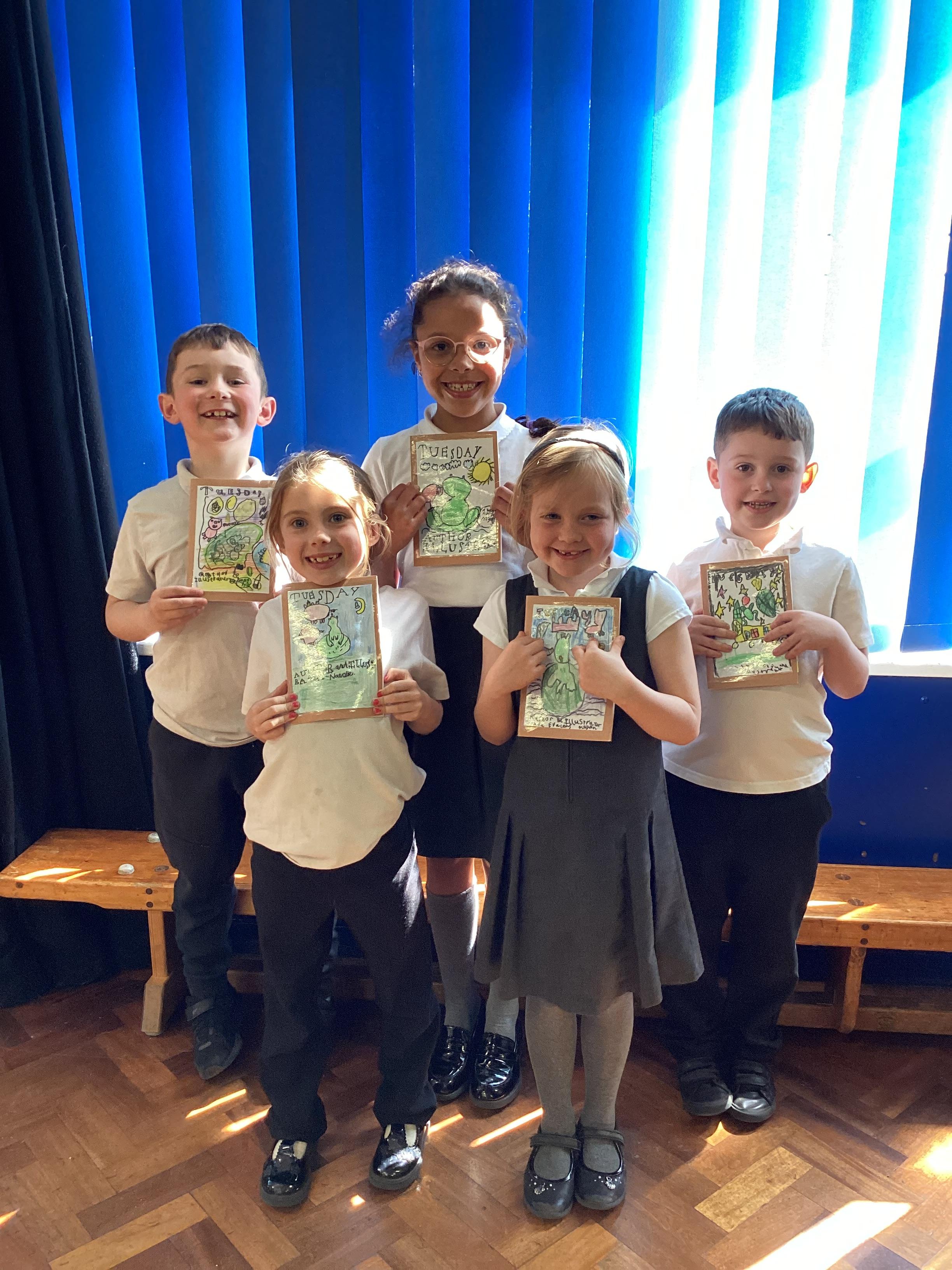 Year 2 pupils with their own books that they wrote and illustrated themselves